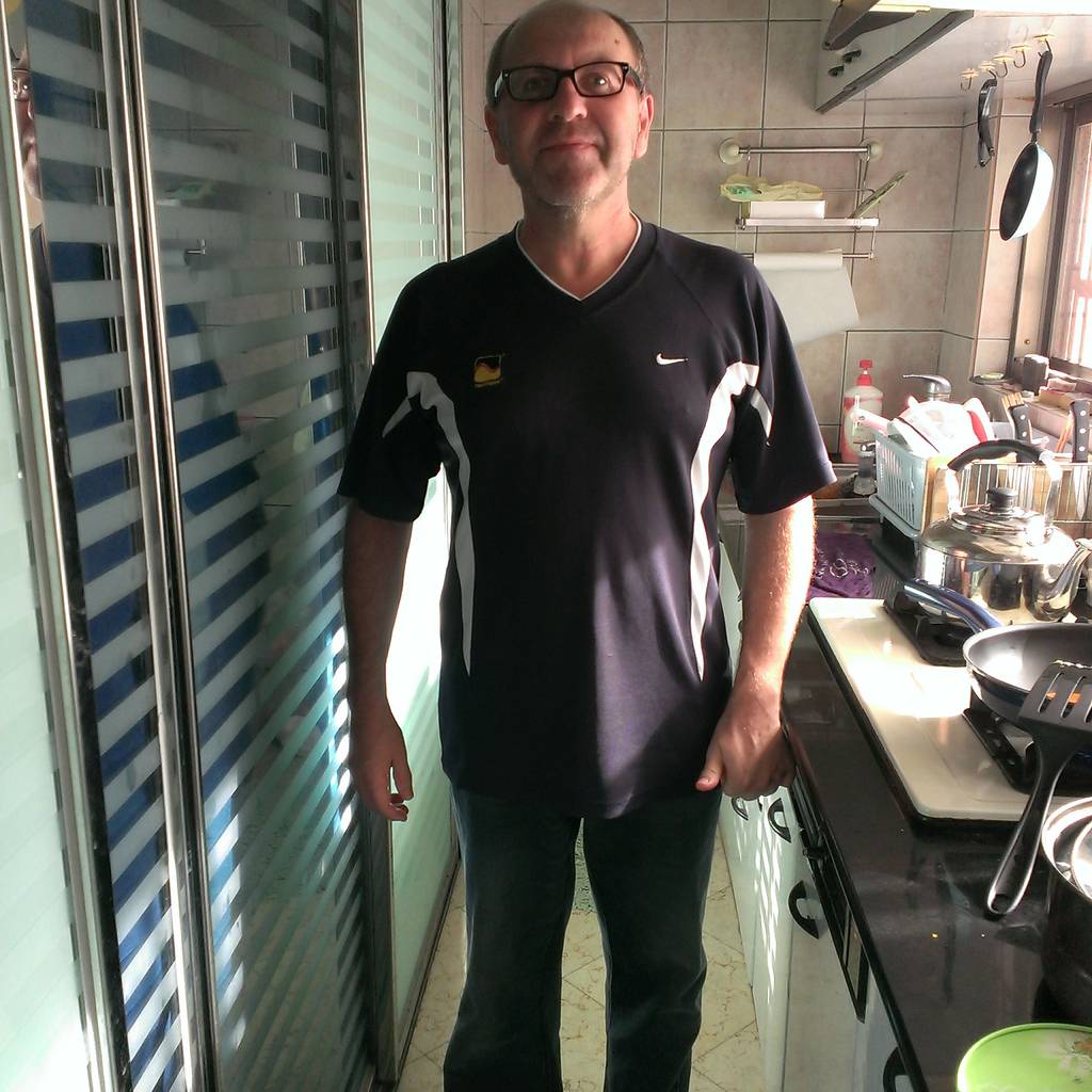 A full-body portrait of Jacques at home.
