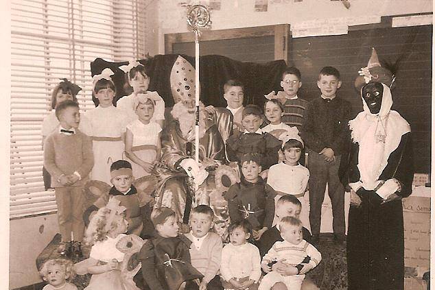 A 1960s school class photograph; Jacques is the small boy at the bottom right, sitting on his eldest brother’s lap.
