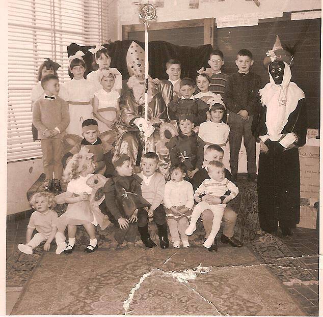 A 1960s school class photograph; Jacques is the small boy at the bottom right, sitting on his eldest brother’s lap.