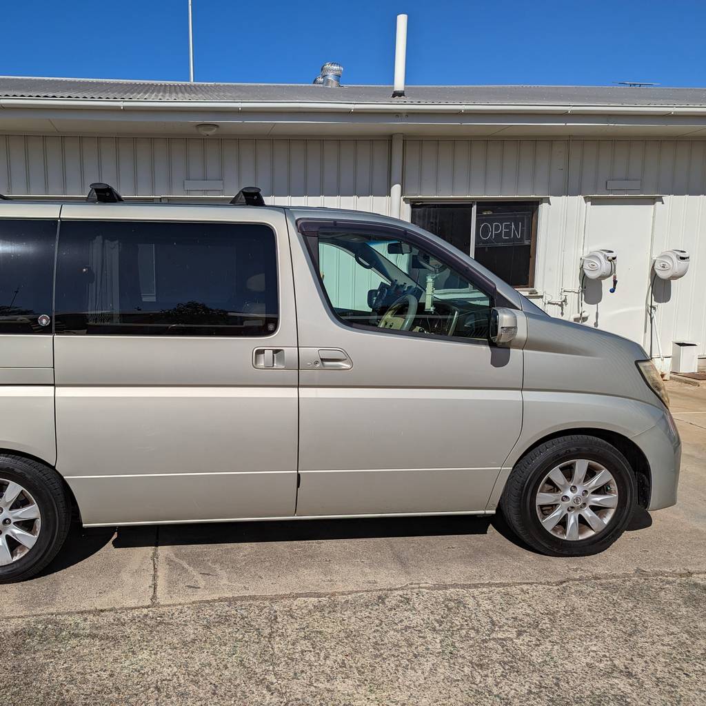 Side profile of Jacques Botte’s old Nissan Elgrand van, 2023.
