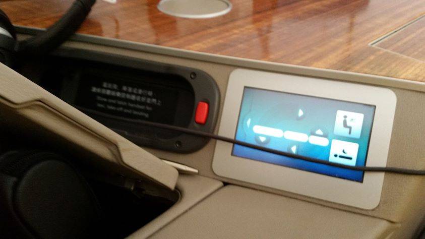 The control panel of an aircraft seat.